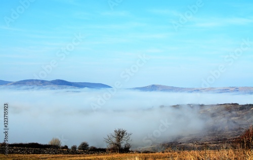 landscape with fog in the valley