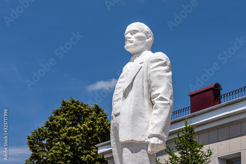 Russia, Apsheronsk: Wladimir Iljitsch Lenin Monument in public park in the city center of the Russian town with skyline - concept travel fame famous memorial remembrance political leader icon history photo