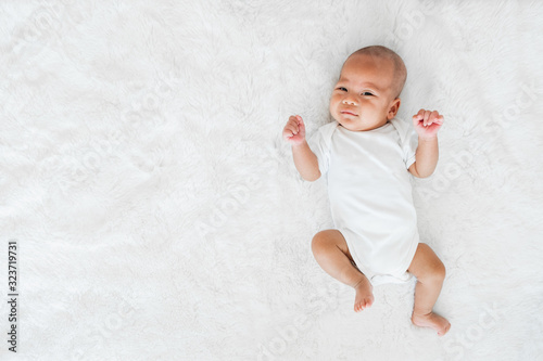 Portrait baby adorable on white bed, newborn concept