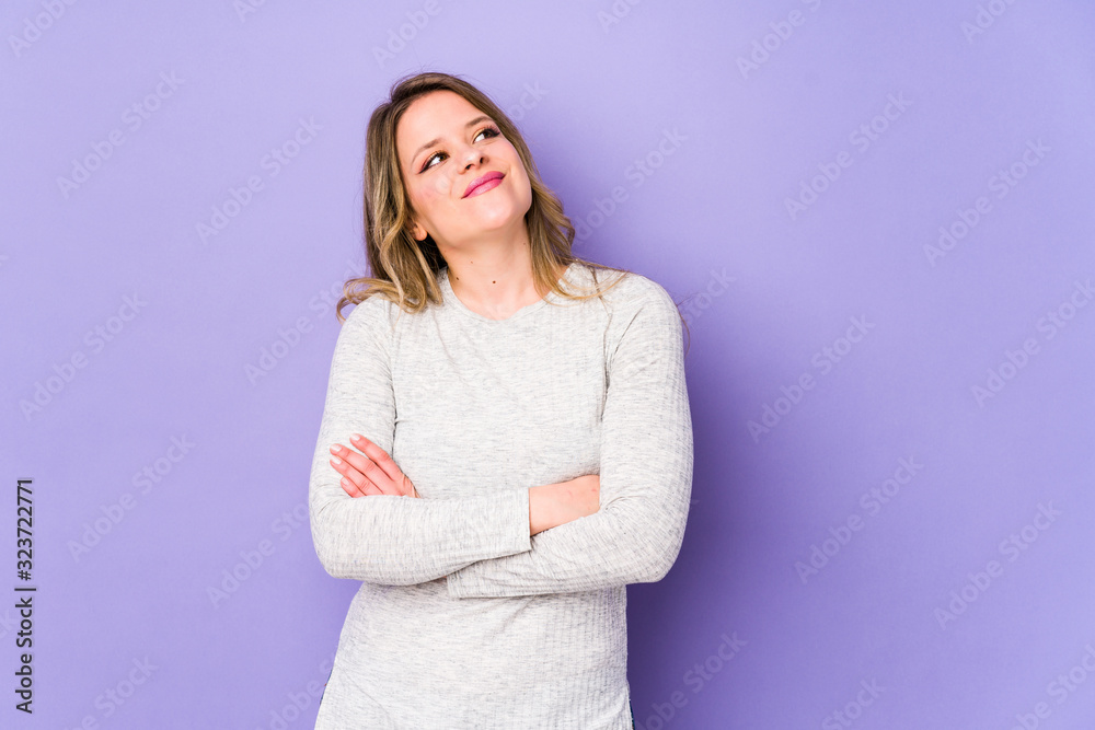 Young caucasian woman isolated on purple background dreaming of achieving goals and purposes Young caucasian woman isolated on purple background dreaming of achieving goals and purposes