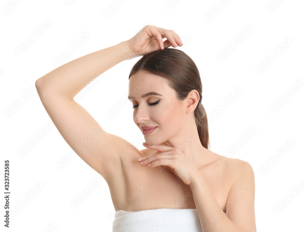 Young beautiful woman showing armpit with smooth clean skin on white background