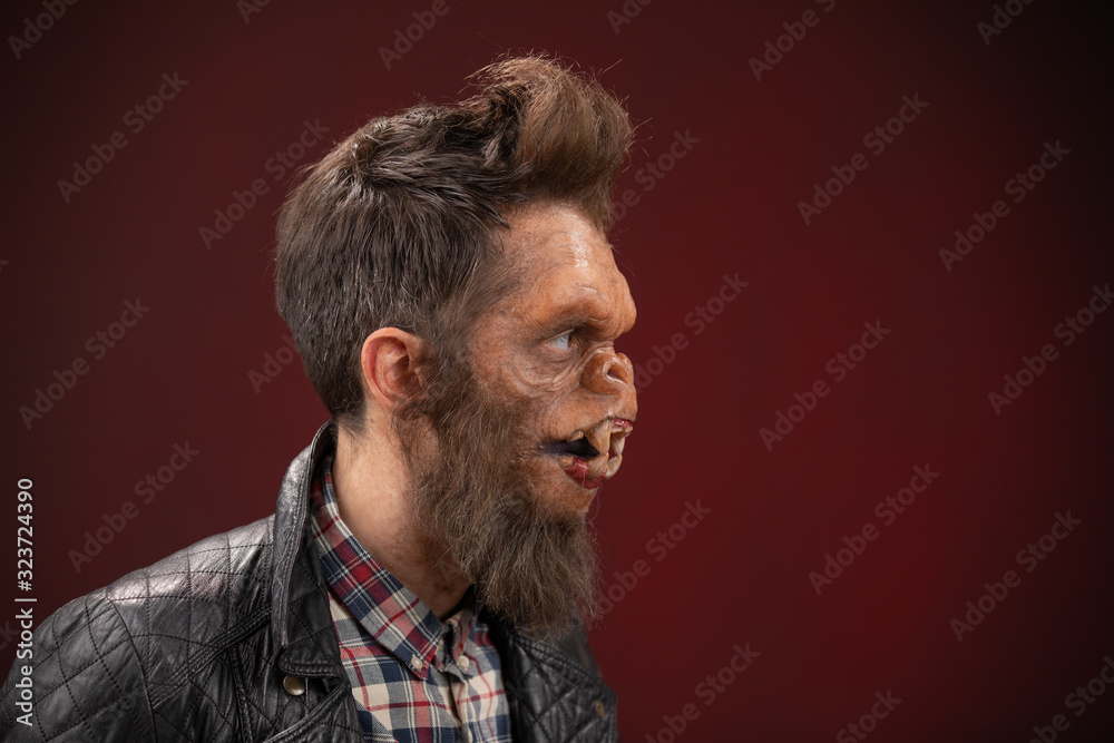 Fototapeta premium Portrait of Monkey man. Monkey man cinematic make-up for horror movie