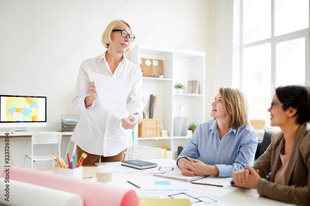 Portrait of three successful businesswomen planning work while collaborating on design project in studio Portrait of three successful businesswomen planning work while collaborating on design project in studio
