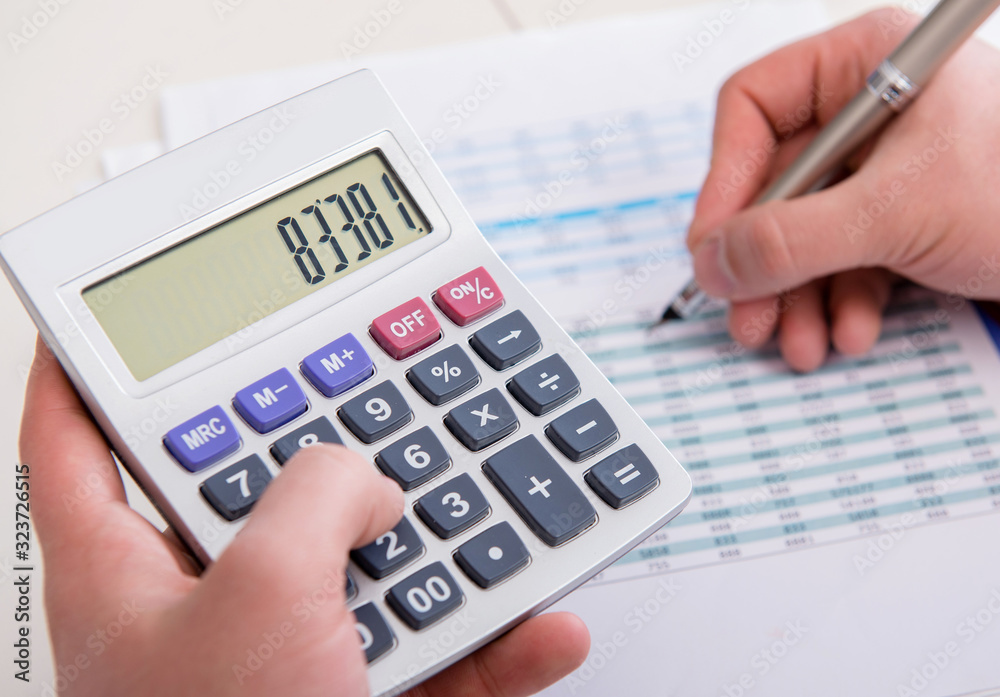 Finance analyst looking and financial reports