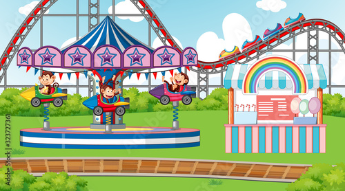 Scene with happy monkeys riding rocket ride in the park