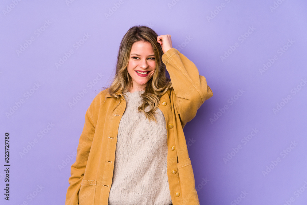 Young caucasian woman isolated on purple background celebrating a victory, passion and enthusiasm, happy expression. Young caucasian woman isolated on purple background celebrating a victory, passion and enthusiasm, happy expression.