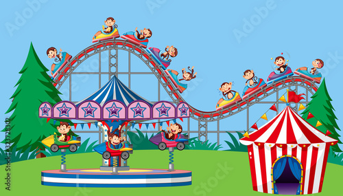 Scene with monkeys on circus rides in the park