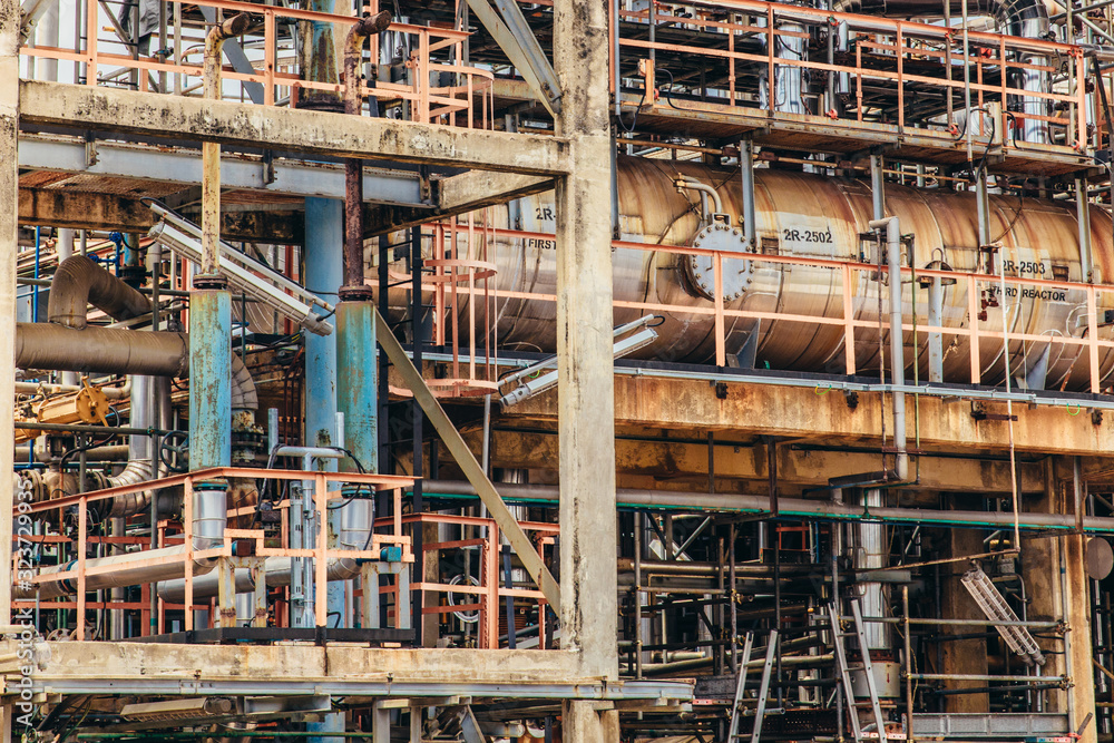 Industrial zone,The equipment of oil refining,Close-up of industrial pipelines of an oil-refinery plant,Detail of oil pipeline with valves in large oil refinery.