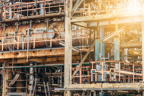 Industrial zone,The equipment of oil refining,Close-up of industrial pipelines of an oil-refinery plant,Detail of oil pipeline with valves in large oil refinery. © vacancylizm