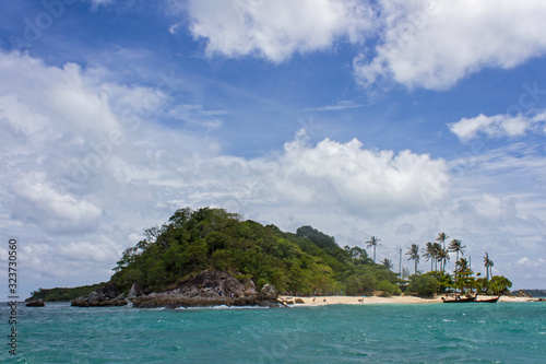 Tropical island in turquoise ocean water
