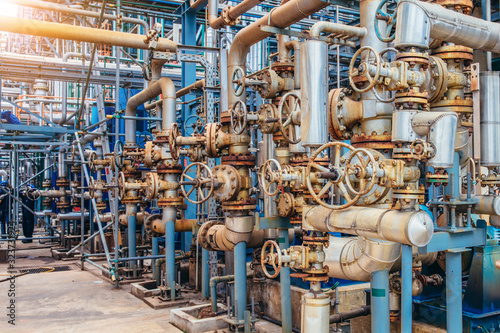 Industrial zone,The equipment of oil refining,Close-up of industrial pipelines of an oil-refinery plant,Detail of oil pipeline with valves in large oil refinery.