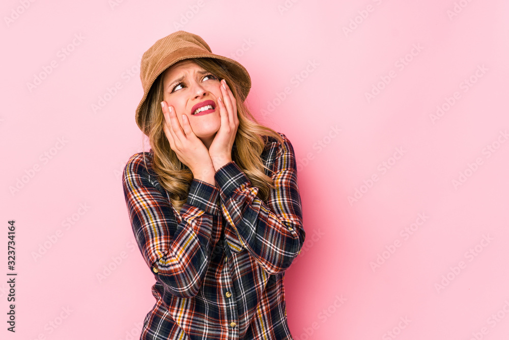 Young caucasian woman wearing a hat isolated whining and crying disconsolately. Young caucasian woman wearing a hat isolated whining and crying disconsolately.