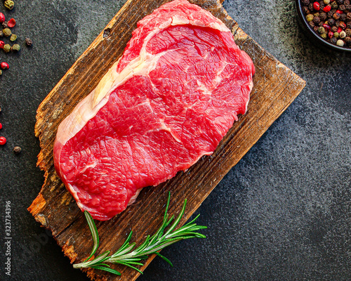 Obraz na plátně raw steak meat (beef or veal cooking) menu concept background