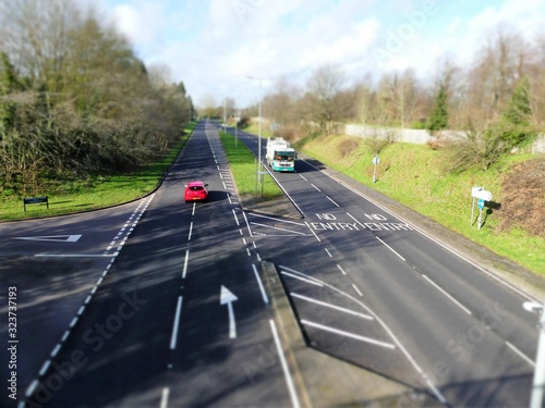 Tilt shift photograph of vehicles on A404 Chorleywood Road near Rickmansworth town centre photo