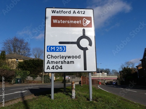 Road sign on A412 in Rickmansworth, Hertfordshire, UK with directions to Chorleywood, Amersham and the M25 motorway plus Watford and the Watersmeet arts and entertainment venue photo