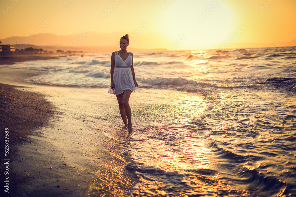 Carefree Woman Enjoying Beautiful Sunset