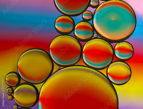 Oil and water abstract bubbles macro closeup with multicolor reflection