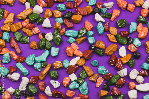 Candy pebbles background. sweets in the form of colored stones
