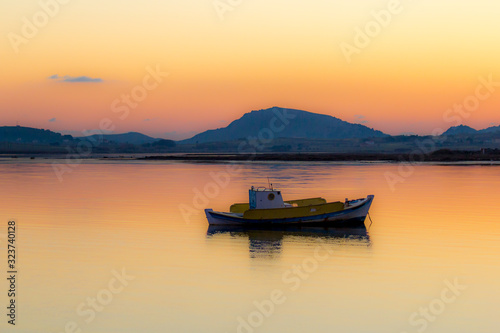 boat at sunset beach and sea Lemnos island Greece © Manos