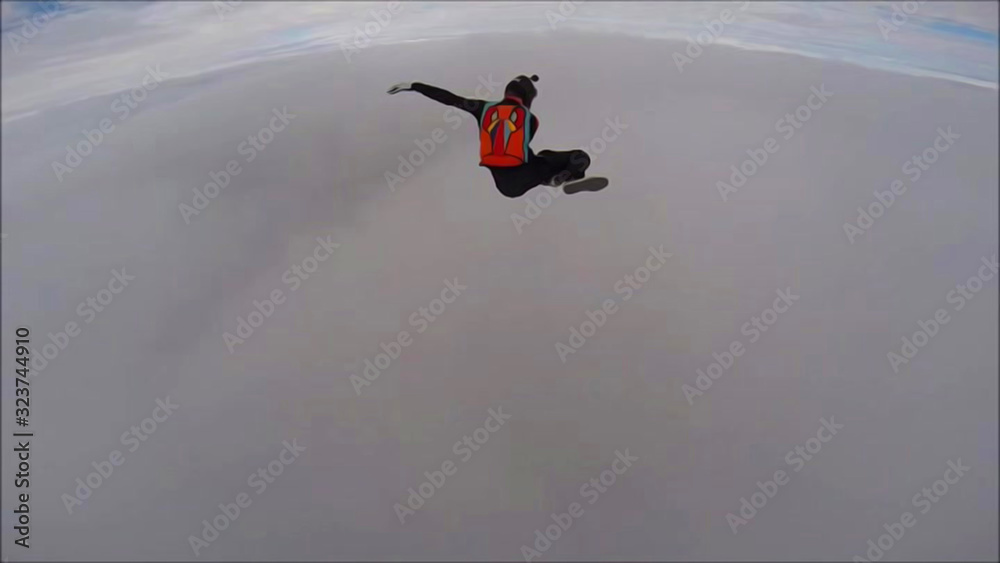 Fototapeta premium Planet. Skydiver travels around the world. There are no rules for brave people. The sky without borders.