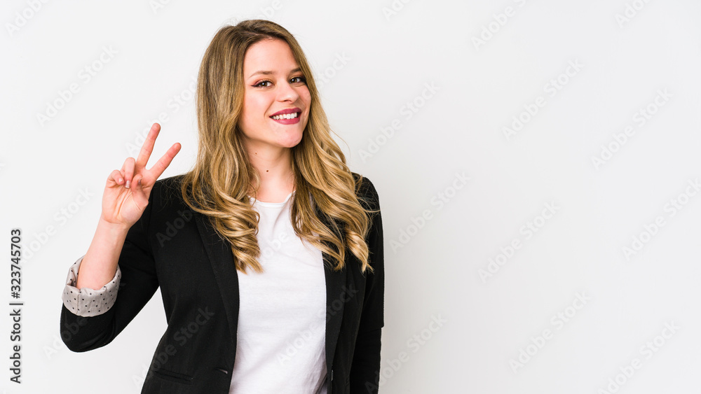 Young caucasian business woman isolated on white background Young caucasian bussines womanjoyful and carefree showing a peace symbol with fingers. Young caucasian business woman isolated on white background Young caucasian bussines womanjoyful and carefree showing a peace symbol with fingers.