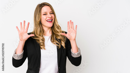 Young caucasian business woman isolated on white background Young caucasian bussines womanshowing number ten with hands. photo