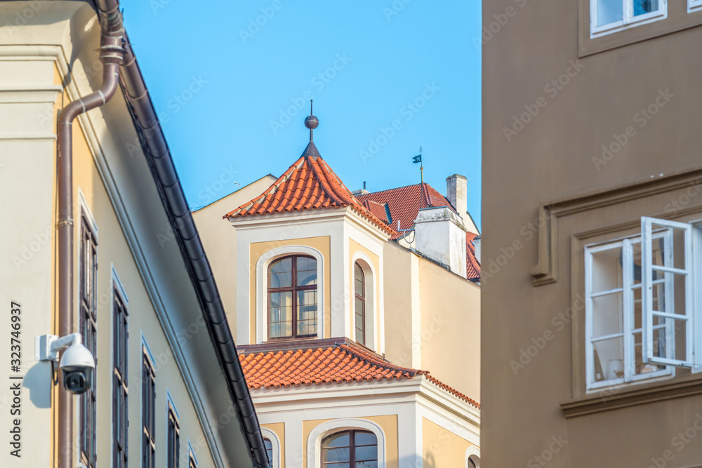 View of the top of old buildings with red roof and blue sky at Prague city Czech republic.