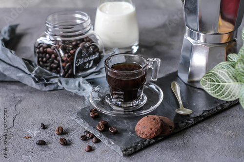 Photo of coffee with milk and homemade cookies. Espresso coffee. Dark background. Image.