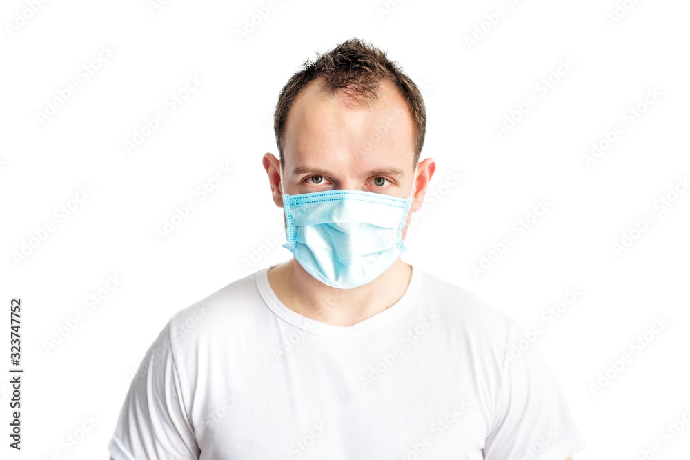 Portrait of serious and self confident caucasian man in blue medical mask on face. Health care in cold season. Prevention of coronavirus covid-2019. Stop coronavirus. Medical and health care. Portrait of serious and self confident caucasian man in blue medical mask on face. Health care in cold season. Prevention of coronavirus covid-2019. Stop coronavirus. Medical and health care.