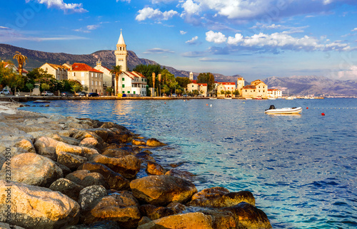 Beautiful coastal towns in Croatia. Scenic Kastella in Dalmatia. View of Kastel Stafilic village over sunset photo