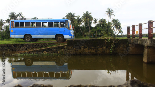 Reflection of bus in river at Kerala, India.