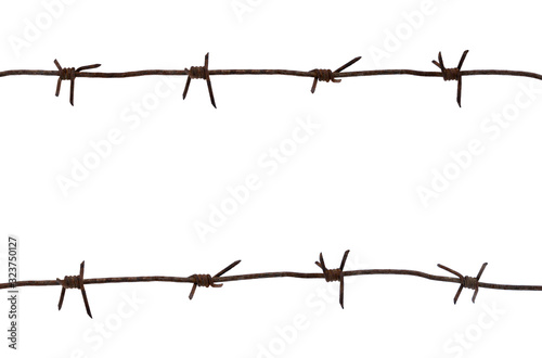 Old rusty metal barbed wire of times of the second world war isolated on white background