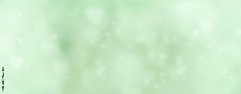 abstract background with soft bokeh and green hearts abstract background with soft bokeh and green hearts
