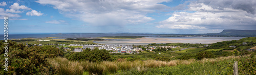 Panorama view of an irish village close to the beach during a blue sunny day 
