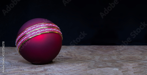 Photography Close up cricket Ball on wooden background with copy space