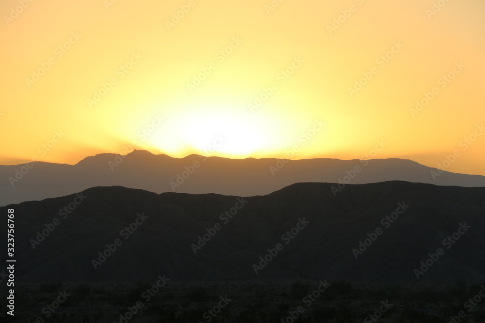desert mountain sunset silhouette western yellow sky