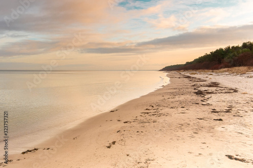 Nature background of sand beach sea landscape at sunset