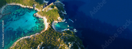 Aerial drone ultra wide photo of famous double paradise azure beach of Porto Timoni in Northern part of Corfu island, Ionian, Greece