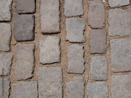Old paving stones closeup, background, texture.