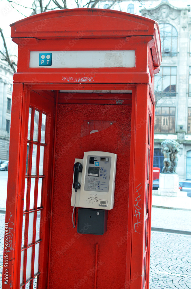 Porto, Portugal-07.02.2020: red telephone box in the city center