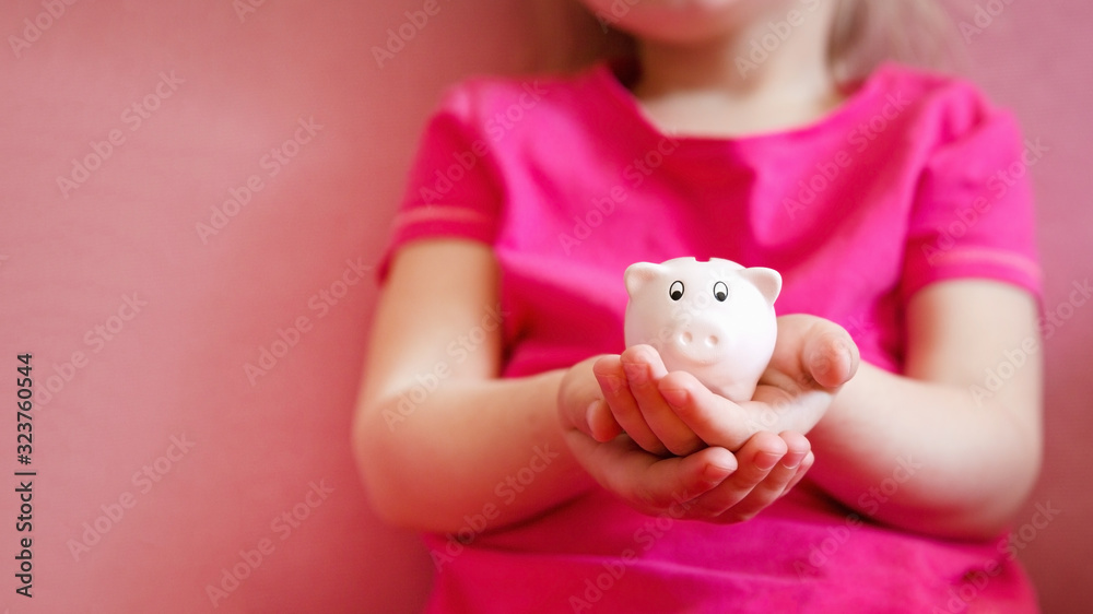 Pink piggy bank on children hands. Pink piggy bank on children hands.