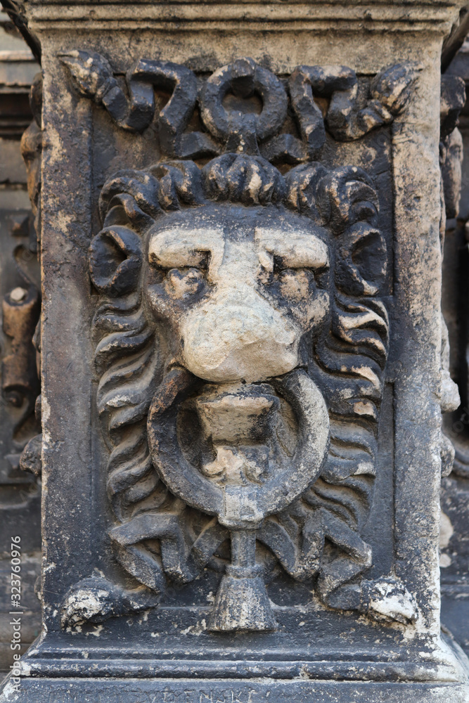 Architectural detail in the form of lion’s muzzle. Ancient architecture. Ruins of temples and castles sooty from age. Damaged by time Architectural detail in the form of lion’s muzzle. Ancient architecture. Ruins of temples and castles sooty from age. Damaged by time