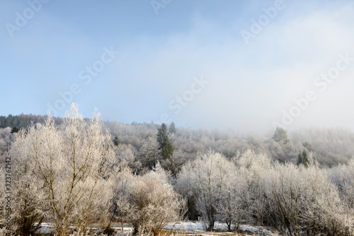 Mountain landscape. Mountain view on a foggy winter morning.In the early foggy morning, the mountains look especially mysterious and beautiful. 