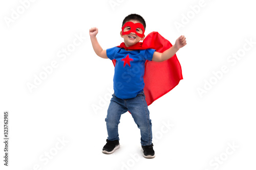 Asian boy with funny little power of hero isolated on white background, Superhero concept © comzeal