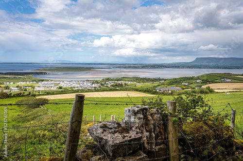 Irish landscape view from the fields and the beach during sunny and cloudy sky I