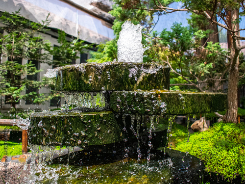 green nature and artificial water cascade