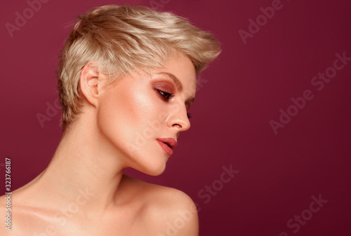 Portrait of seductive blonde woman with short hairstyle