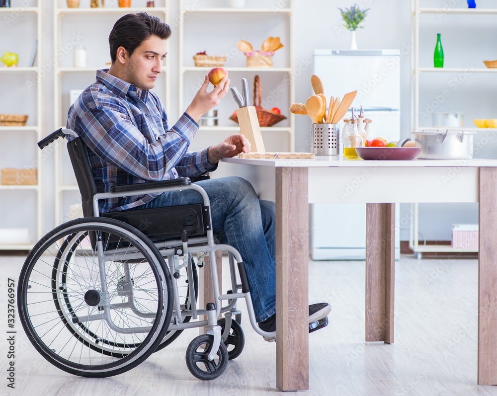Disabled young man husband working in kitchen Disabled young man husband working in kitchen