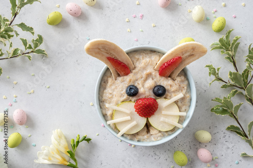 Naklejka Funny bunny oatmeal bowl with fruits, for kids Easter breakfast