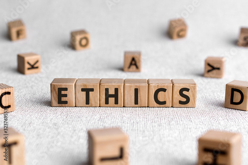 Ethics - words from wooden blocks with letters, ethics moral philosophy concept, white background photo